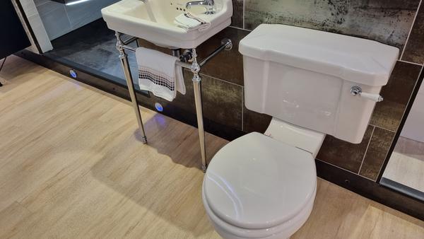 Traditional toilet and cloakroom basin on a chrome stand complete with taps